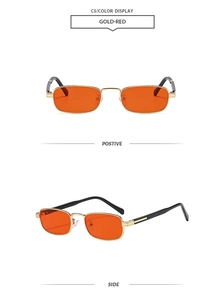 Macro view of retro small square sunglasses with gold metal frame and dark red lenses