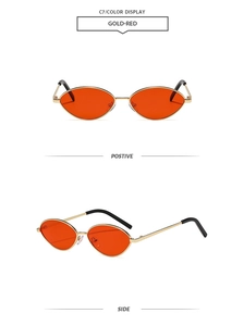Front and side view of oval metal sunglasses with gold frames and red lenses