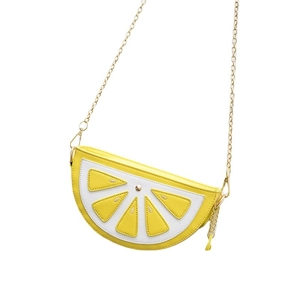 Vibrant lemon slice crossbody bag with yellow leather finish and gold metal chain strap