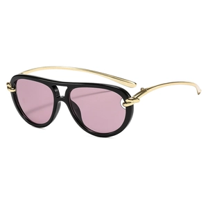 Modern double-bridge aviator sunglasses with black frames, pink lenses, and gold metal temples