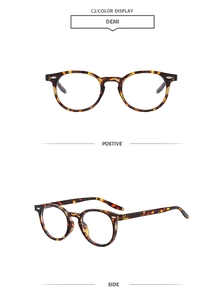 Close-up of vintage round demi frames with stylish rivets and polished finish