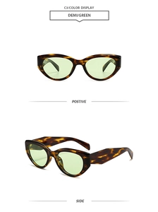 Detailed views of vintage cat-eye sunglasses with demi frames and green lenses