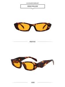 Detail view of demi frames with yellow lenses in y2k retro narrow rectangle style