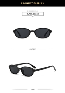 Front and side views of black oval vintage sunglasses with silver hinge details