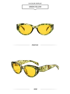 Detail of green tortoiseshell cat-eye sunglasses with yellow transparent lenses