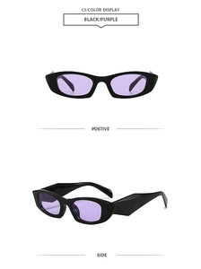 Macro shot of stylish narrow black cat-eye sunglasses featuring transparent purple lenses