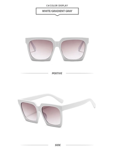 Detailansicht der weißen quadratischen Übergroße Sonnenbrille mit grauem Verlaufsglas vorne