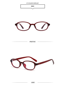 Detail view of red retro oval sunglasses showing both front and side profiles clearly