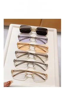 Detail view of rimless square sunglasses with metallic star decor in six various colors