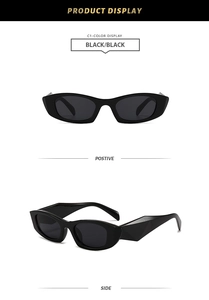 Detail view of stylish black rectangle sunglasses with wide geometric textured temples