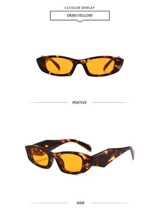Detail view of retro small frame demi sunglasses with yellow lenses and wide temples