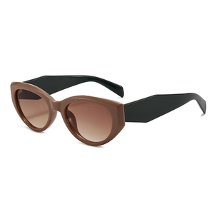 Vintage cat-eye sunglasses with caramel brown frames and dark gradient lenses