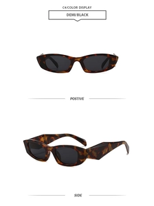 Detail view of vintage tortoise shell rectangle sunglasses with dark grey lenses