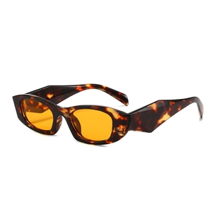 Retro cat-eye tortoiseshell sunglasses with orange lenses and chunky irregular legs
