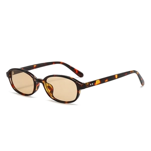 Vintage oval tortoiseshell sunglasses with amber lenses and silver metal rivets