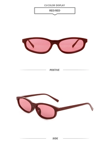 Detailed close-up of red oval sunglasses with matching lenses showing side and front angles