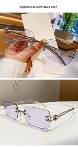 Detail view of T307 rimless sunglasses with light blue lenses and silver metal hinges