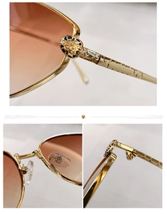 Detailed view of the leopard head emblem and golden hinges on cat-eye sunglasses