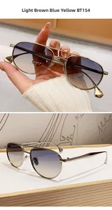 Dettaglio occhiali da sole aviator in nichel con doppio ponte e lenti sfumate blu-giallo