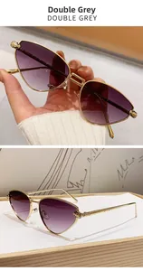 Detailed close-up of cat-eye sunglasses featuring golden leopard head temple ornaments