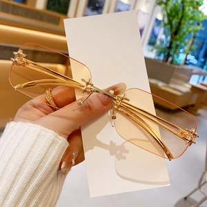 Modern rimless square sunglasses with peach gradient lenses and golden metal frame