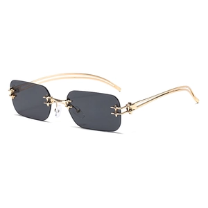 Frameless square sunglasses with dark grey lenses and gold metal frame with star accents