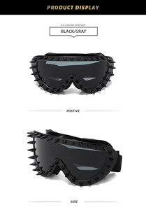 Detail view of black punk cycling sunglasses with spike frame and gray lenses