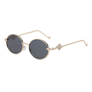 Lunettes de soleil rondes rétro avec monture dorée et détails de serpent sur les branches