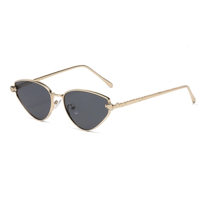 Fashionable gold metal cat-eye sunglasses featuring detailed leopard head relief design