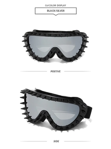 Macro detail of punk windproof goggles with silver mirror lenses and black studded spikes