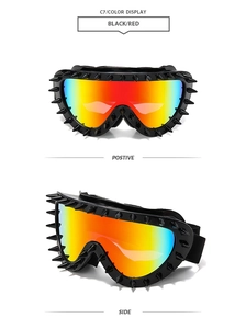 Detail view of punk spiked goggles with red mirrored lenses and matte black frame