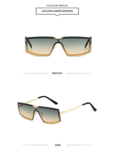 Detail view of large rimless metal sunglasses with golden frame and gradient brown lenses