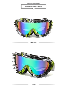 Detail of punk style camouflage sunglasses with silver spikes and colorful mirrored lens