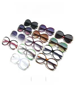 Flat lay of retro oversized round sunglasses in multiple colors and stylish frames