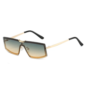 Fashionable oversized square sunglasses with gradient lenses and a thin gold metal frame