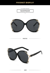 Detail view of round oversized sunglasses with gold metal accents and square geometry