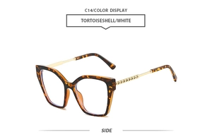 Detail view of tortoiseshell square sunglasses frame with engraved golden metal hinges