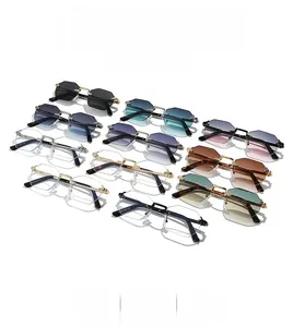 Detailed flat lay of rimless geometric sunglasses with gradient lenses and gold metal arms