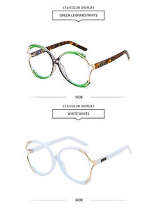 Detail view of round oversized sunglasses in green leopard and white with gold temples