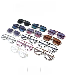 Flat lay of colorful double-bridge metal sunglasses showcasing varied lens colors and frames