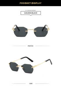 Detailed close-up showing rimless octagonal grey lenses and golden metal frames of sunglasses