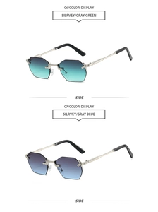 Detail view of rimless octagonal sunglasses with silver metal frames and gradient lenses