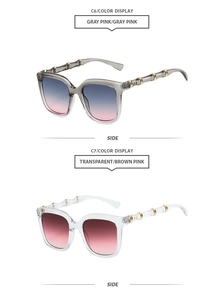 Detail view of retro square sunglasses with unique bamboo-style temples and metal rings