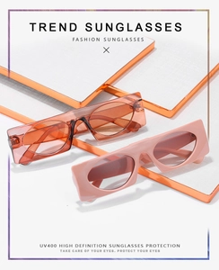 Detail of square vintage sunglasses in orange and pink with UV400 protective lenses