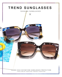 Detail view of square frame gradient sunglasses with marble patterns and UV400 protection