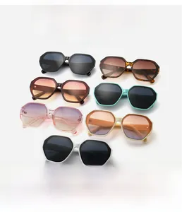 Detail view of seven oversized square sunglasses in black, tortoiseshell and pastel colors