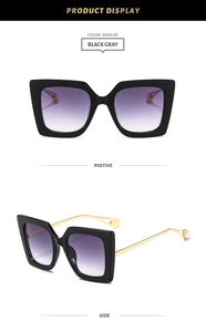Detail of square gradient sunglasses with pearl-decorated golden metal temples