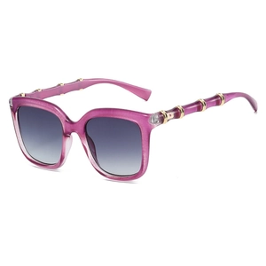Vintage oversized square sunglasses with purple frames and golden bamboo-style temples