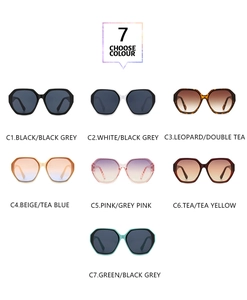 Collection of seven oversized hexagonal sunglasses in various frame colors and tinted lenses