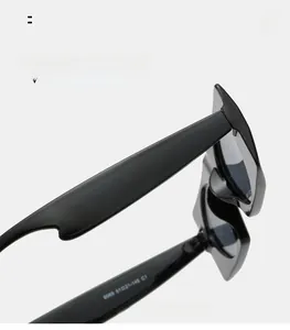 Close-up of black geometric sunglasses arm with 9069 51021-145 size specifications